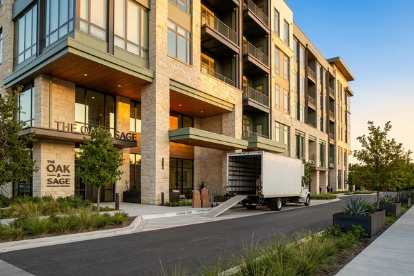 Moving truck outside a new Dallas apartment building